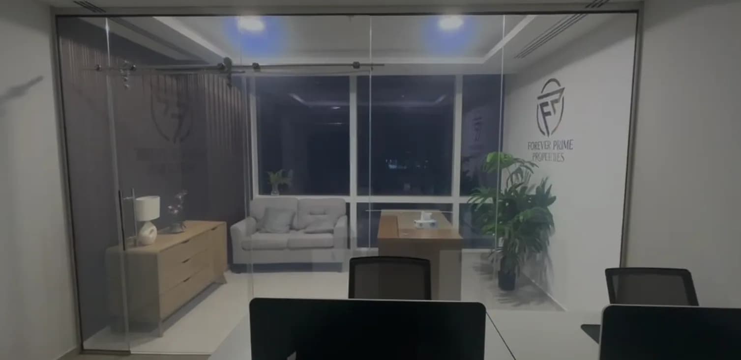 Glazed executive office with frosted branding applied to the partition